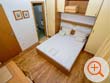 one of the beds and bathrooms of the holiday home Galeb